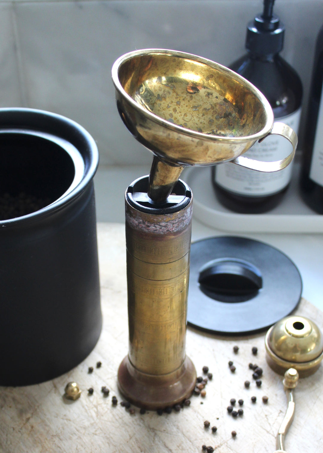 Solid brass funnel with pepper grinder for multi-use kitchen and pantry organization