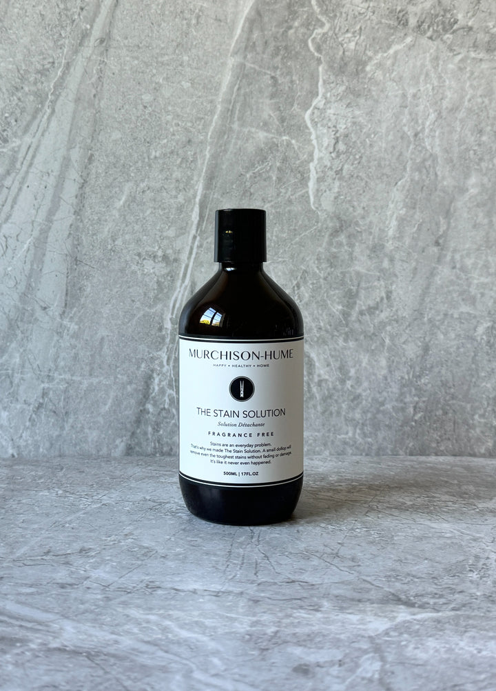 The Stain Solution on stone surface showing eco-friendly enzyme-based formula for tough stain removal